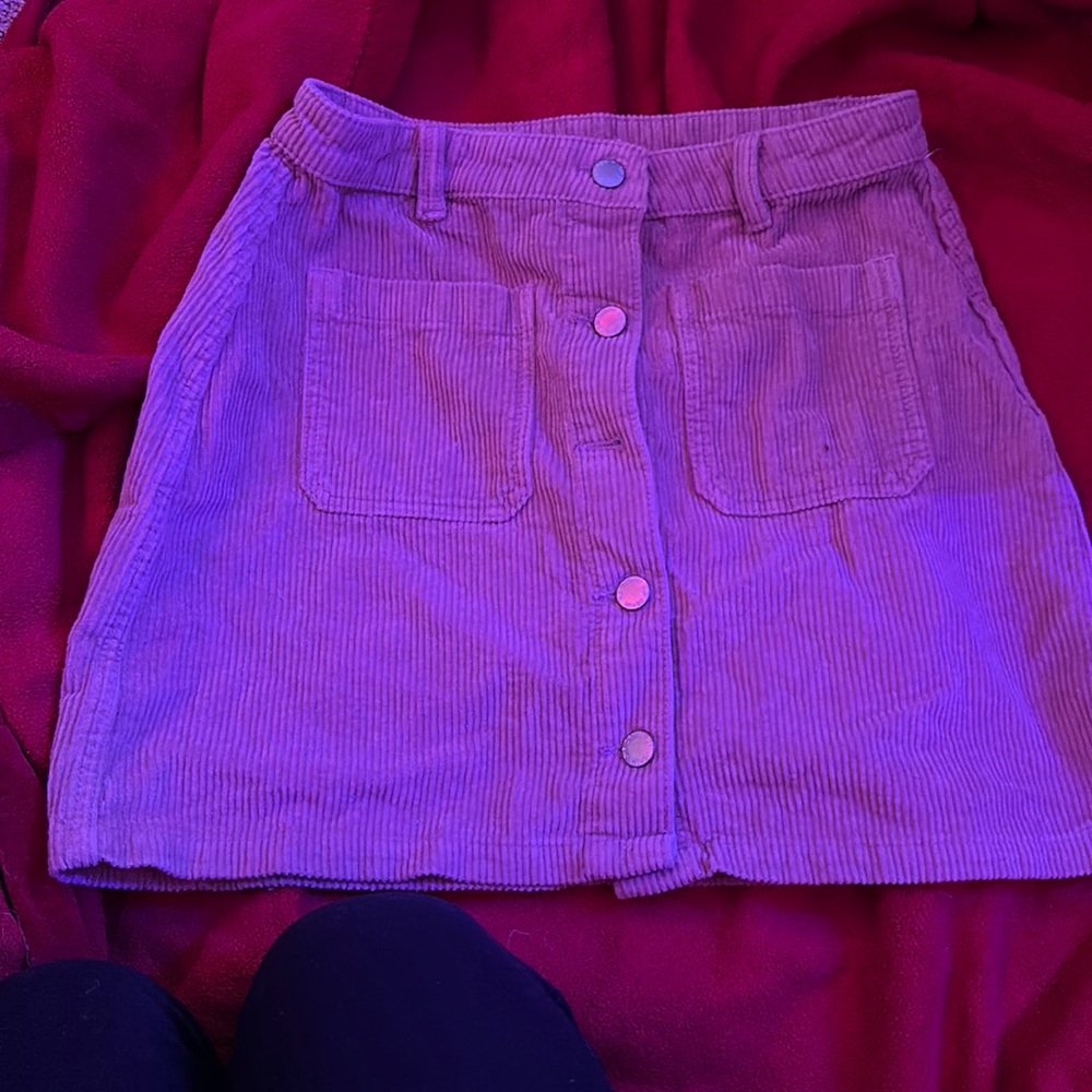 This is a cute velvet/jean skirt that can be worn with a belt